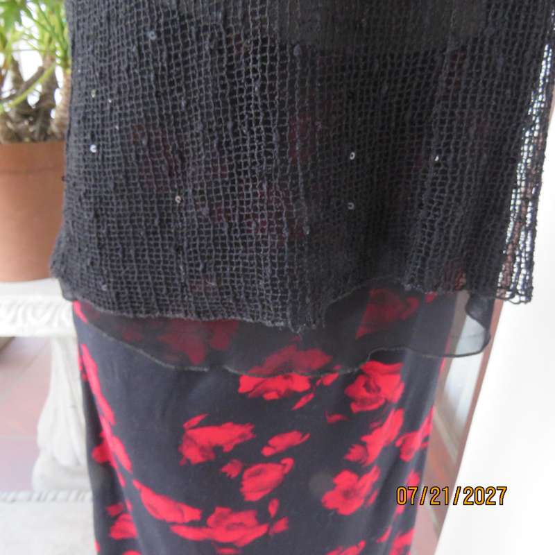 Black sleeveless 2 layer top size 36 with top layer in textured stretch sequined mesh.