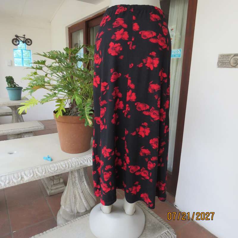 AMARA soft stretch polyester black slightly A-line skirt with red flowers. Size 38