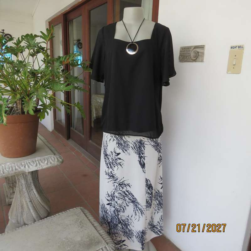 Black smart bell sleeve 2 layer sheer polyester square neck top. Size 40.