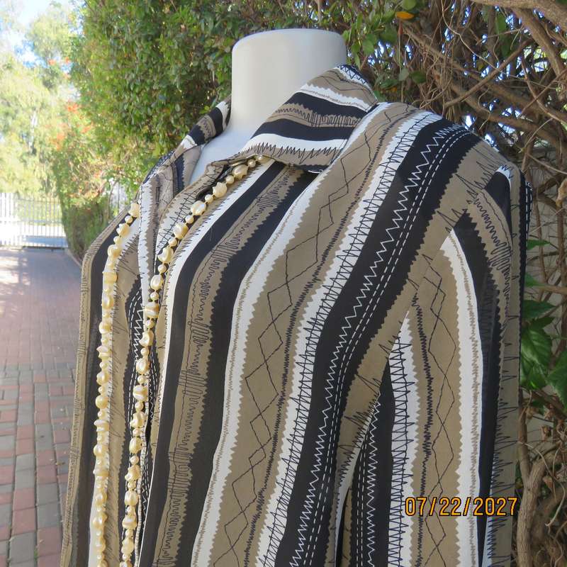LARGELY FEMININE 2 pc polyester A-line skirt and long sleeve top outfit. Vertical striped. Size 42