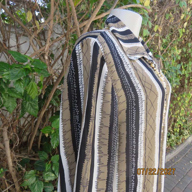 LARGELY FEMININE 2 pc polyester A-line skirt and long sleeve top outfit. Vertical striped. Size 42