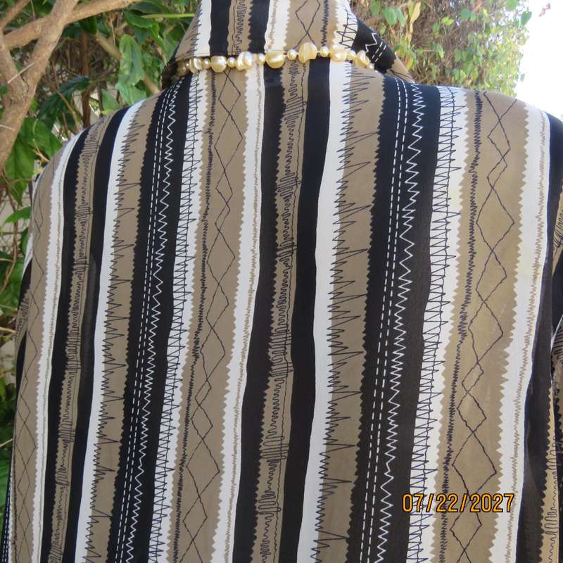 LARGELY FEMININE 2 pc polyester A-line skirt and long sleeve top outfit. Vertical striped. Size 42