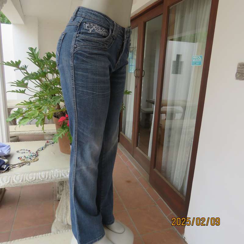 Sexy high quality blue denim stretch polycotton bootcut jeans. Size 32-34. With 5 pockets. As new