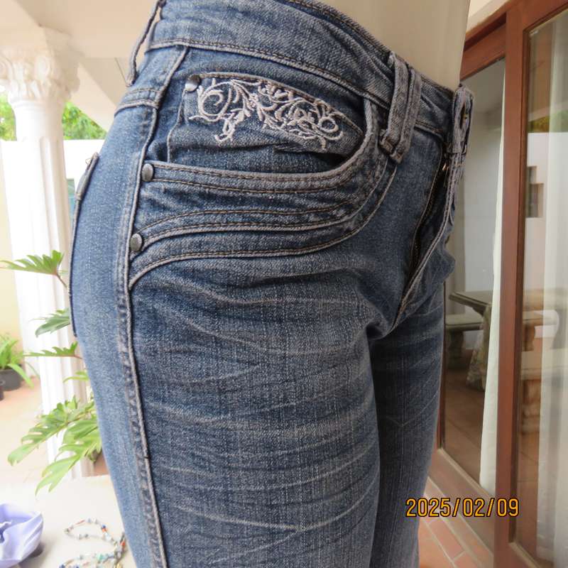 Sexy high quality blue denim stretch polycotton bootcut jeans. Size 32-34. With 5 pockets. As new