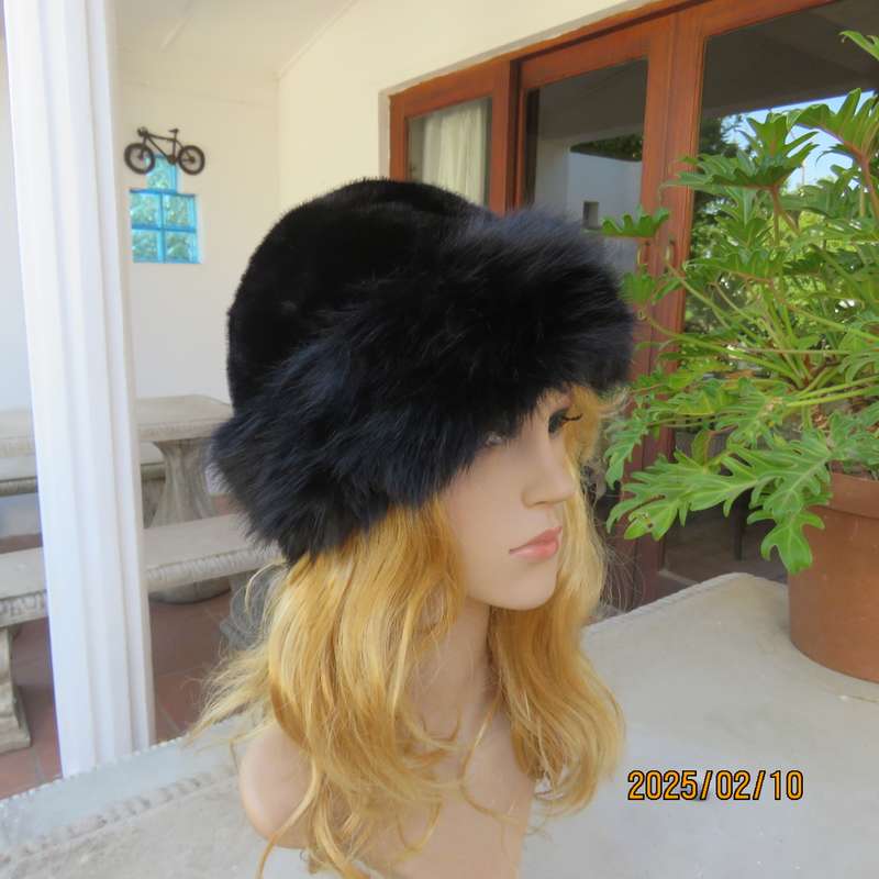 Luxury black faux fur Mongolian style hat with some stretch. Smart or casual wear. New item.
