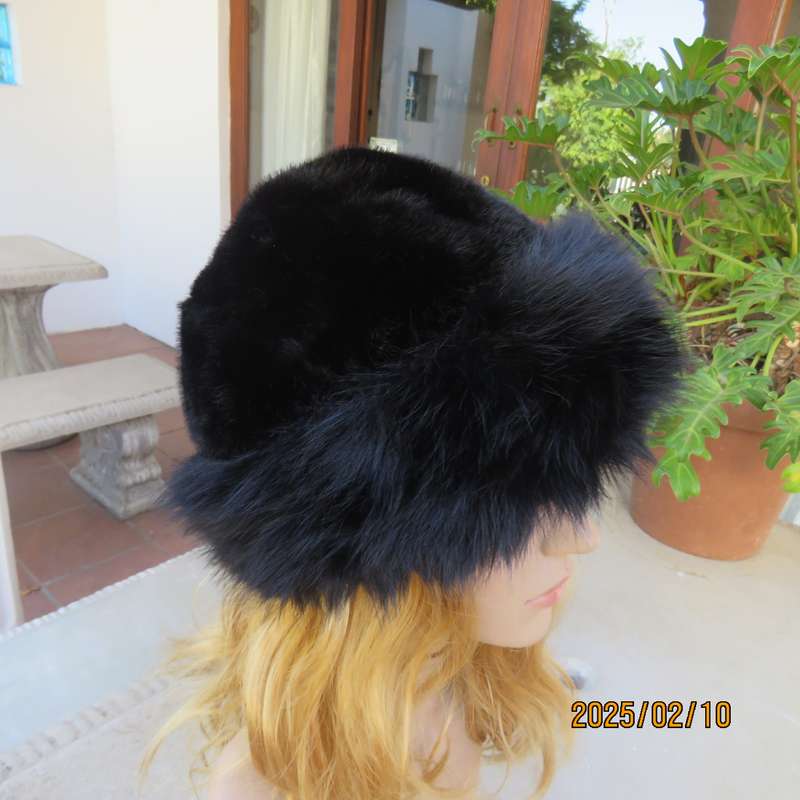 Luxury black faux fur Mongolian style hat with some stretch. Smart or casual wear. New item.