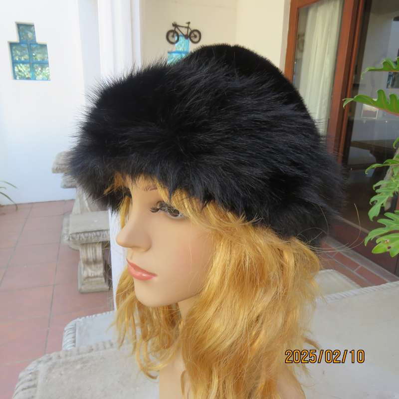 Luxury black faux fur Mongolian style hat with some stretch. Smart or casual wear. New item.