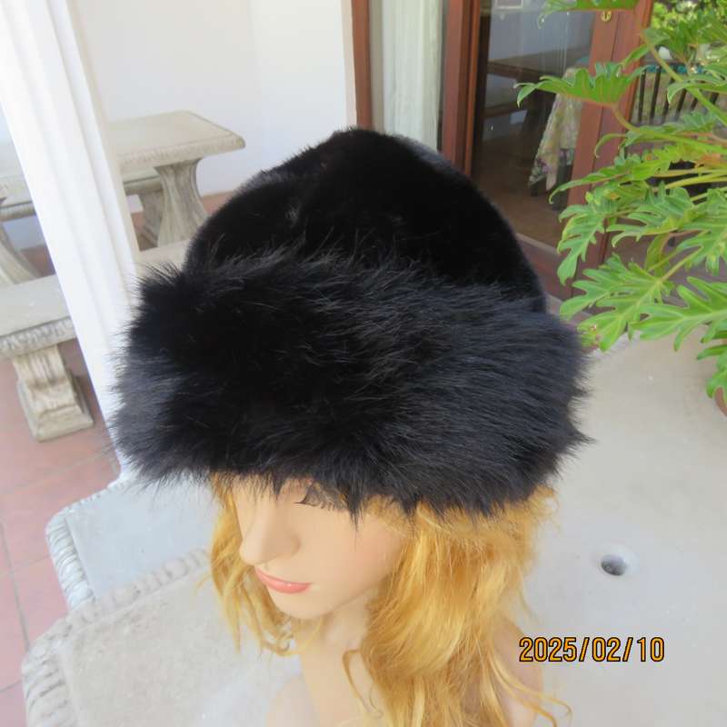 Luxury black faux fur Mongolian style hat with some stretch. Smart or casual wear. New item.