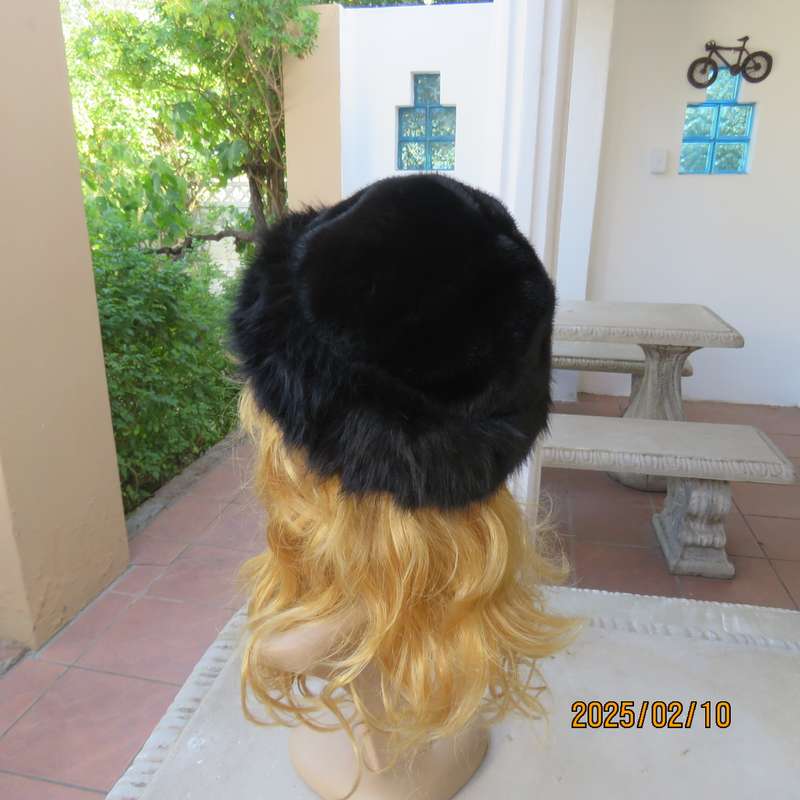 Luxury black faux fur Mongolian style hat with some stretch. Smart or casual wear. New item.