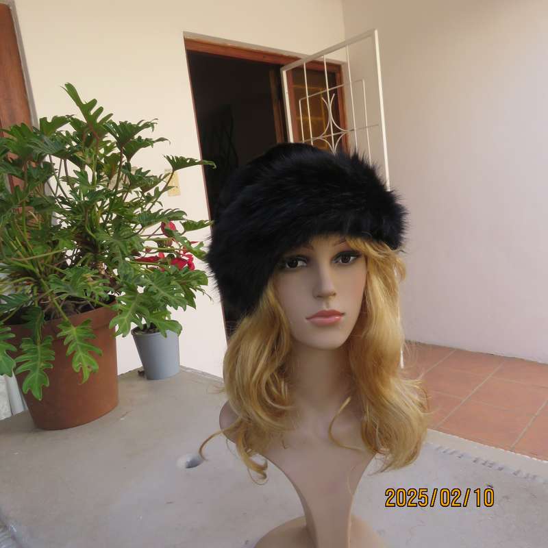 Luxury black faux fur Mongolian style hat with some stretch. Smart or casual wear. New item.
