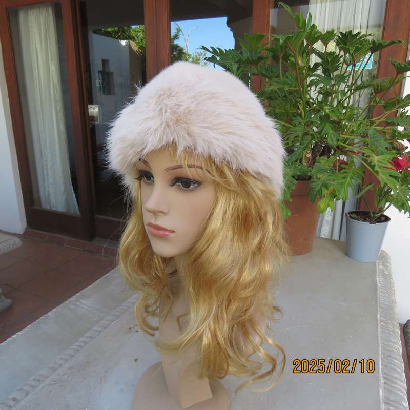 Soft cream faux fur urban style warm hat with some stretch. Warm for winter. New item.