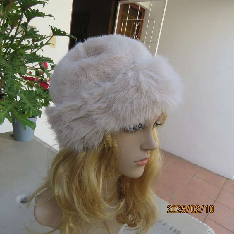 Soft cream faux fur urban style warm hat with some stretch. Warm for winter. New item.
