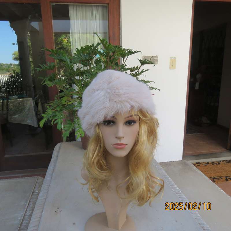 Soft cream faux fur urban style warm hat with some stretch. Warm for winter. New item.