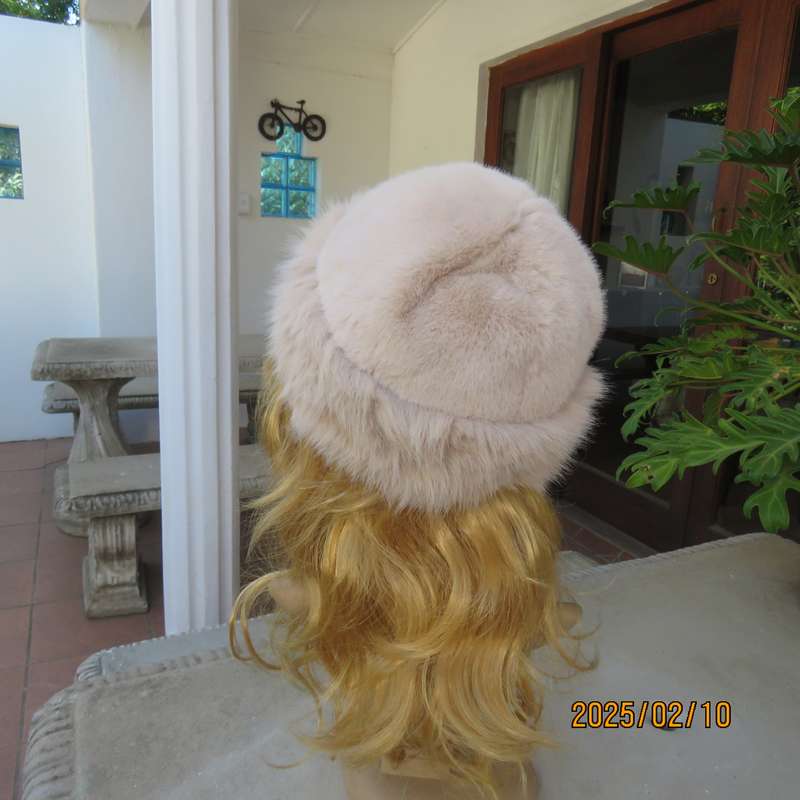 Soft cream faux fur urban style warm hat with some stretch. Warm for winter. New item.