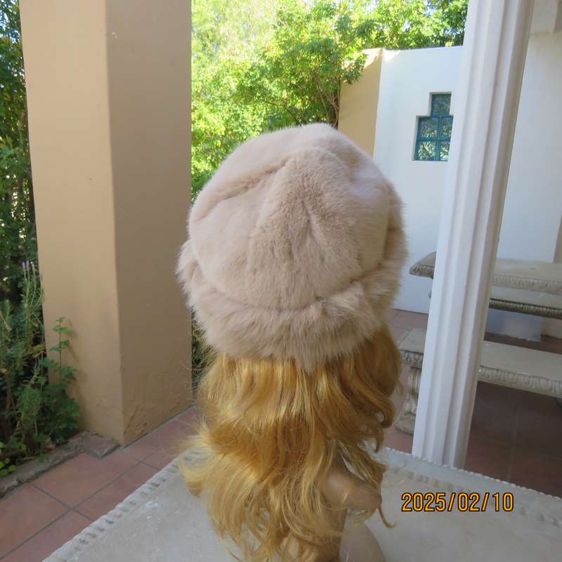 Soft cream faux fur urban style warm hat with some stretch. Warm for winter. New item.