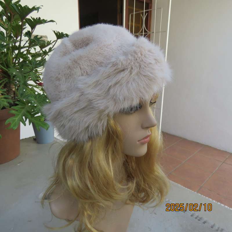 Soft cream faux fur urban style warm hat with some stretch. Warm for winter. New item.