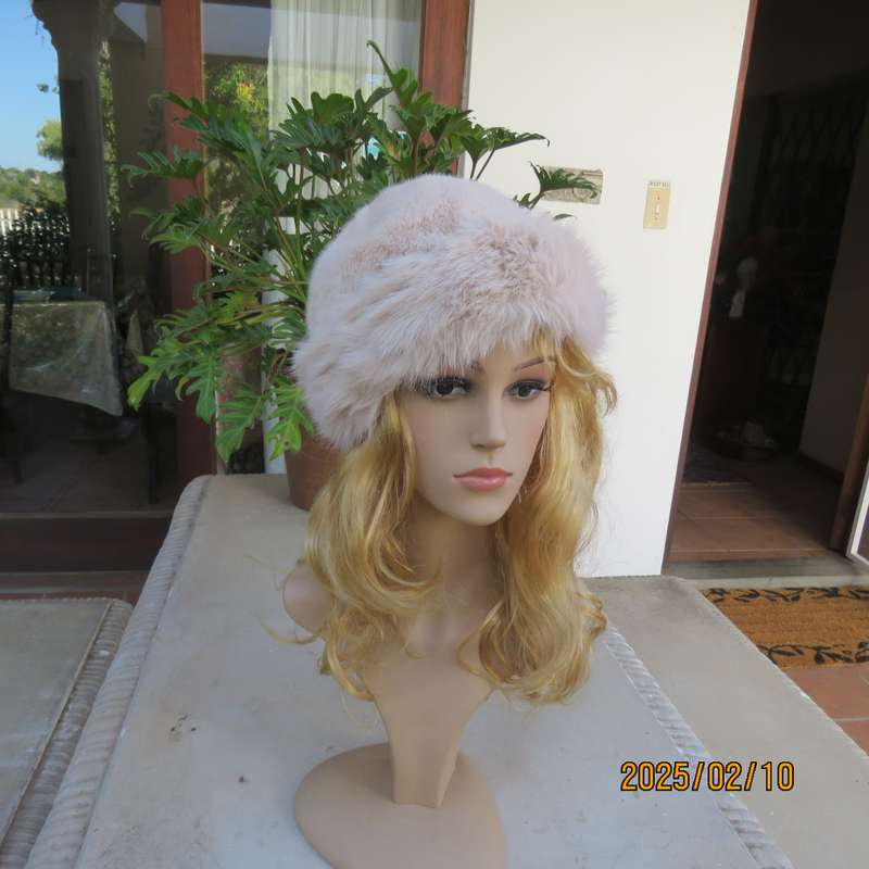 Soft cream faux fur urban style warm hat with some stretch. Warm for winter. New item.