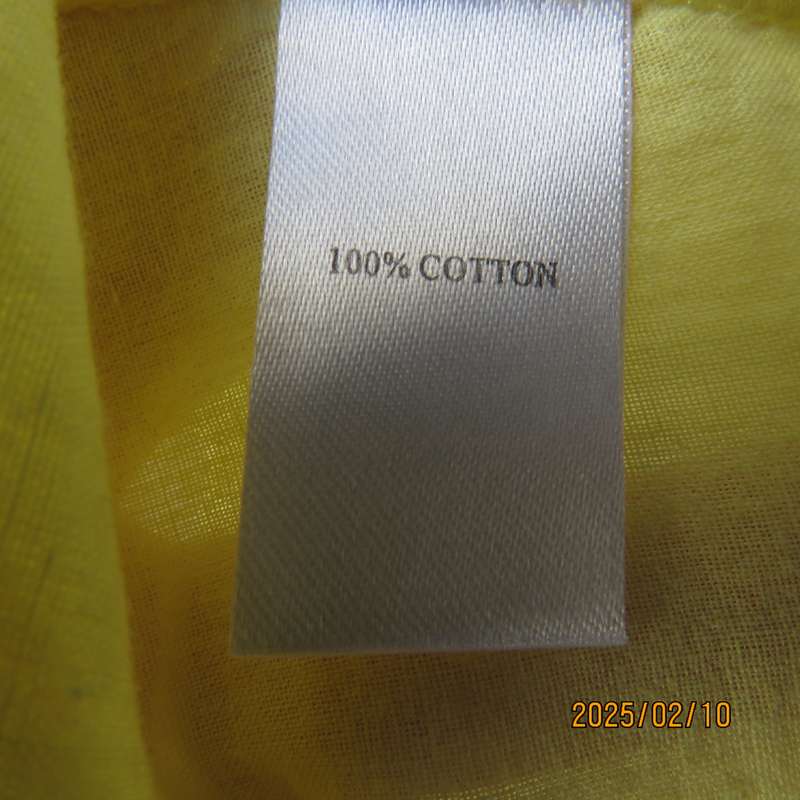 Buttercup yellow sleeveless top with V open collar. Gathered yoked. Fine cotton. Size 46.As new.