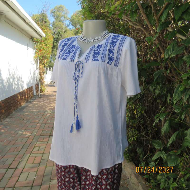 White creased cotton slip over short sleeve top. Blue embroidered front yoke. Size 36