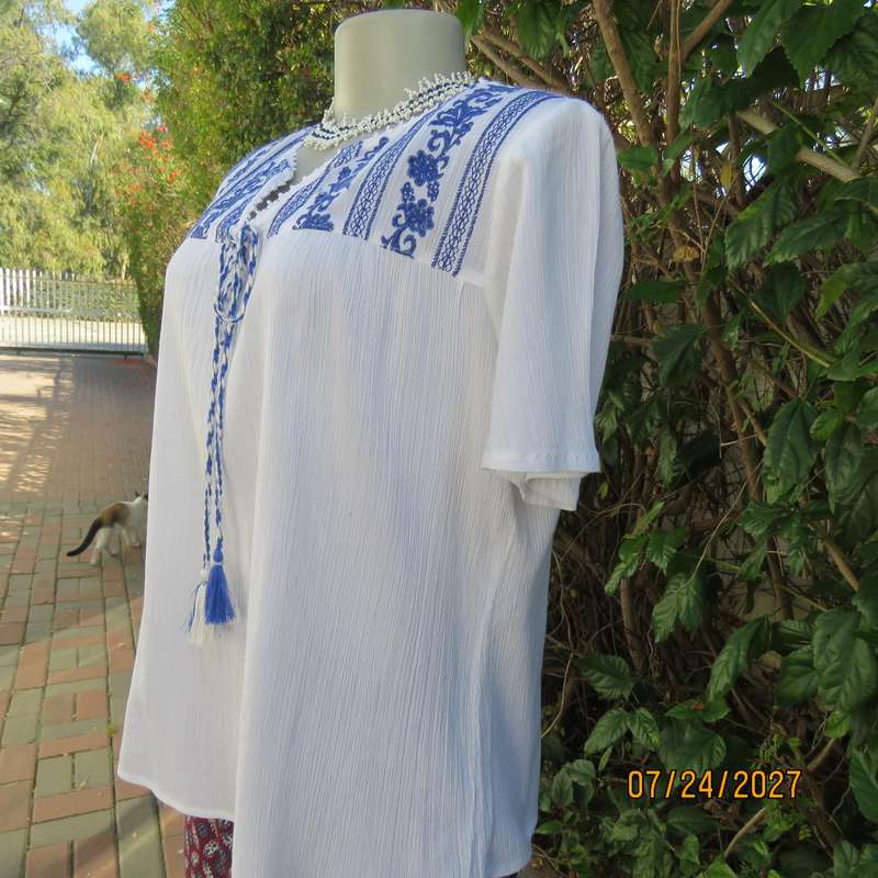 White creased cotton slip over short sleeve top. Blue embroidered front yoke. Size 36