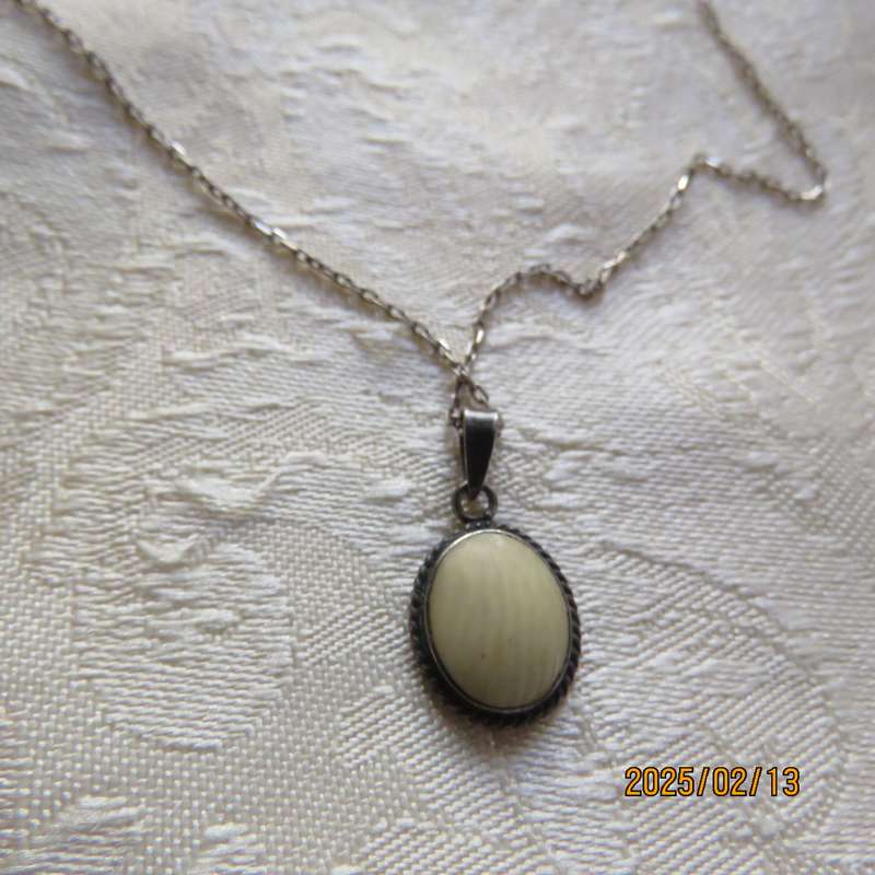 Beautiful 925 silver pendant and chain with marking. Can be faux ivory stone. As new