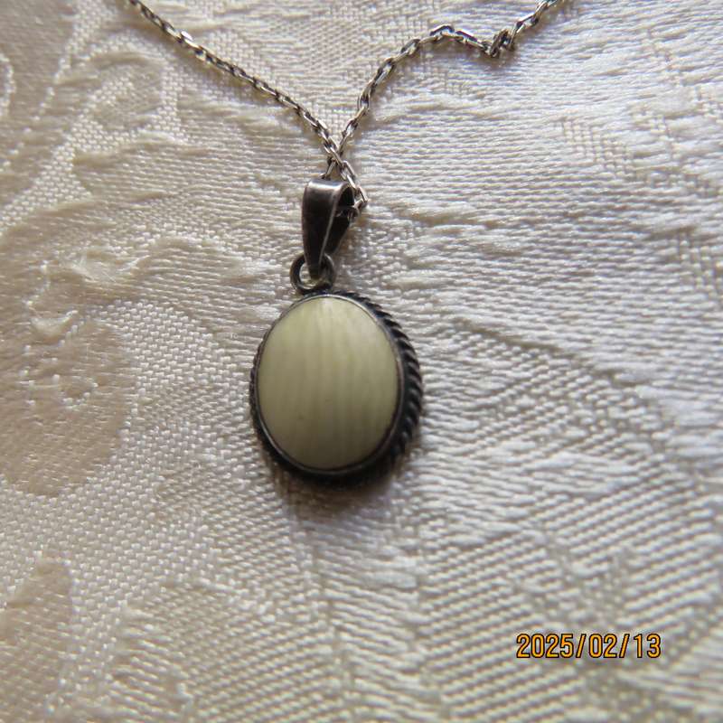 Beautiful 925 silver pendant and chain with marking. Can be faux ivory stone. As new