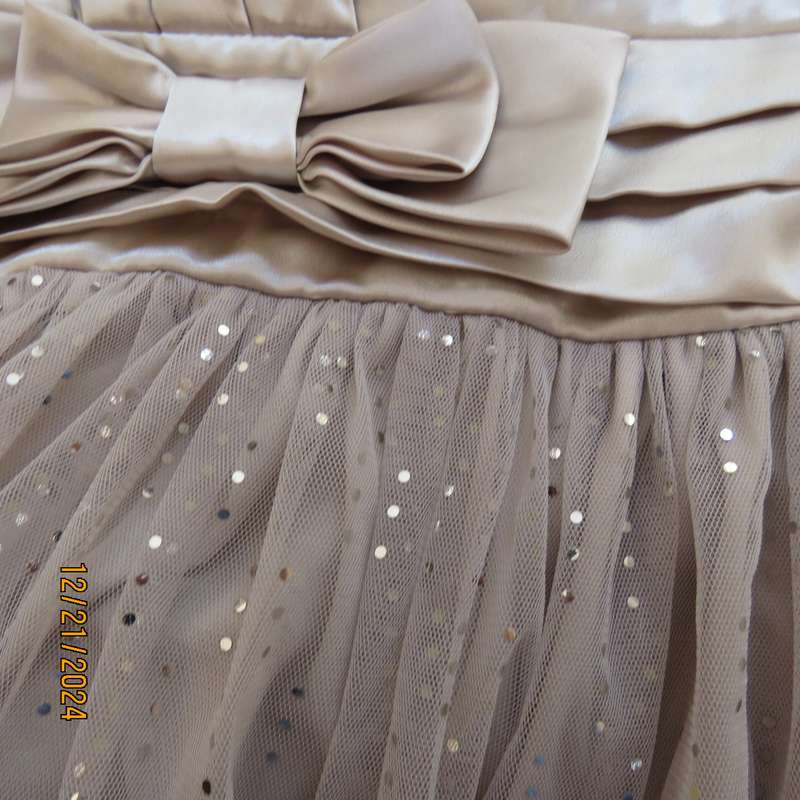 Evening dress in ivory pearl. Strapless poly /satin stretch bodice.Netting/sequin bottom. Size 38.