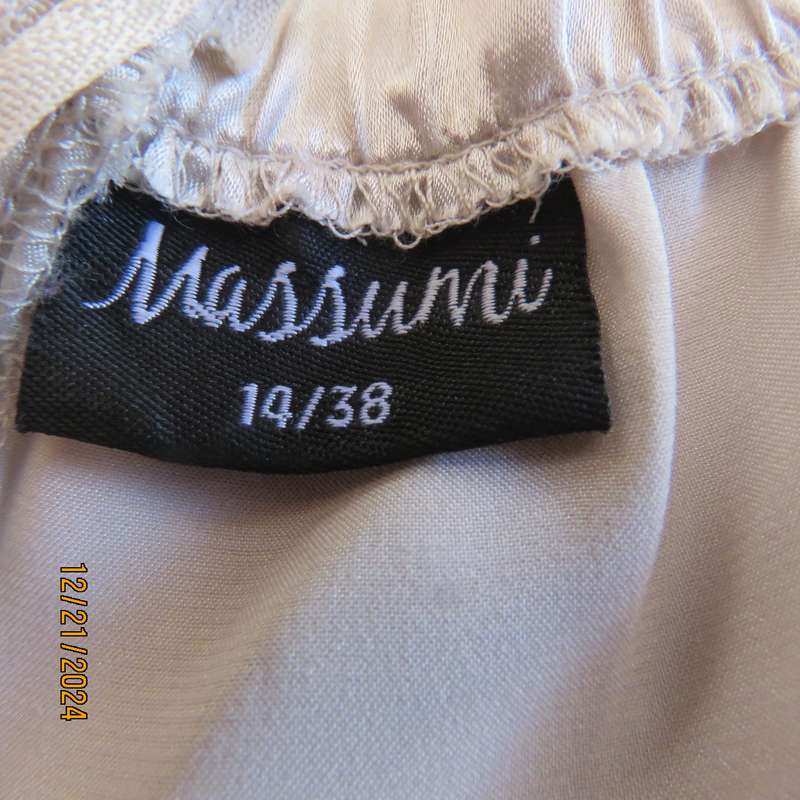 Evening dress in ivory pearl. Strapless poly /satin stretch bodice.Netting/sequin bottom. Size 38.