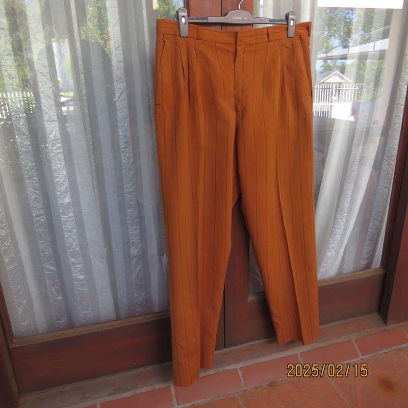 HUGO MARTELLI vintage rust colour men's pants with brown vertical stripes. Size 38. Still as new.