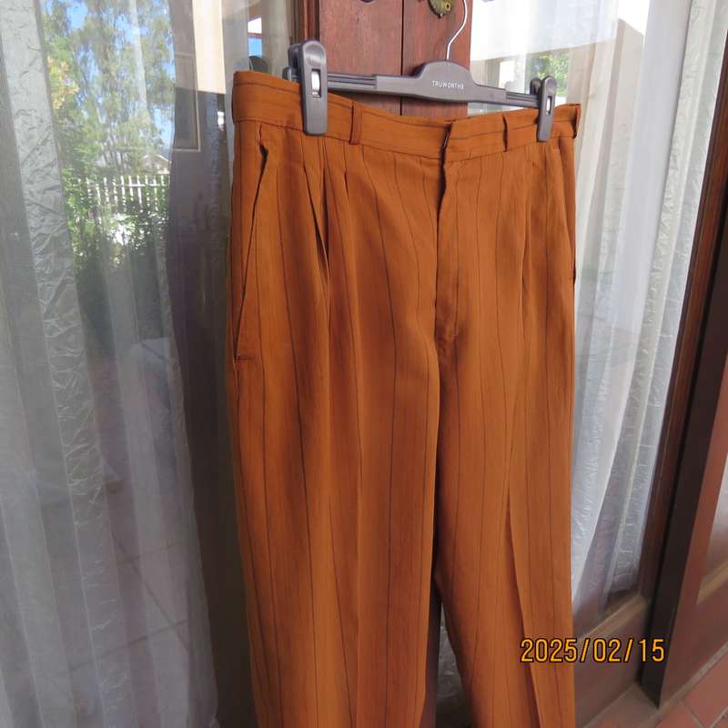 HUGO MARTELLI vintage rust colour men's pants with brown vertical stripes. Size 38. Still as new.