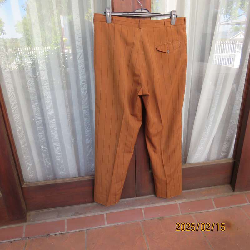 HUGO MARTELLI vintage rust colour men's pants with brown vertical stripes. Size 38. Still as new.