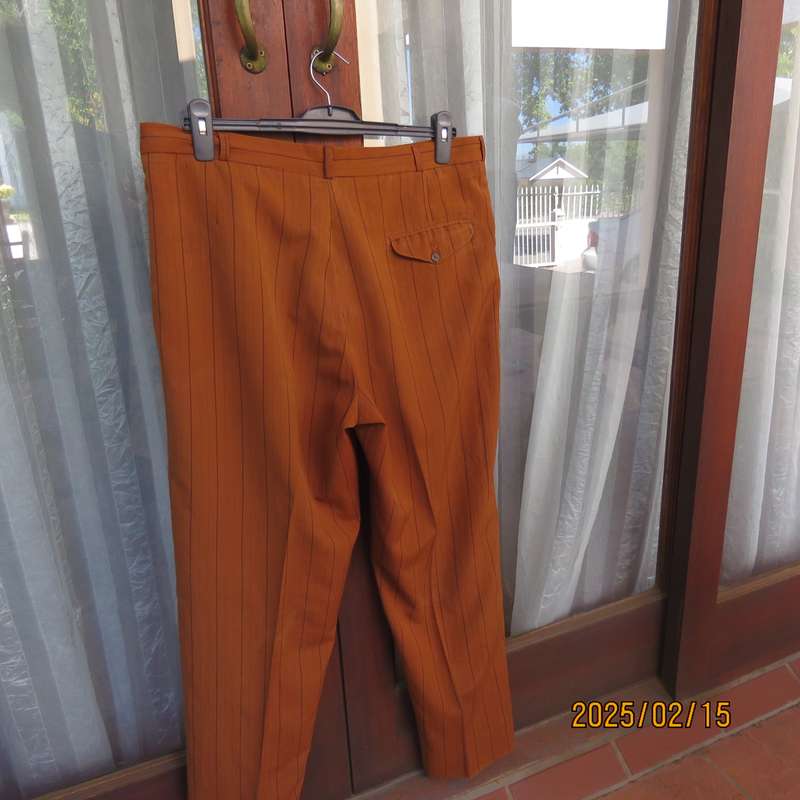 HUGO MARTELLI vintage rust colour men's pants with brown vertical stripes. Size 38. Still as new.