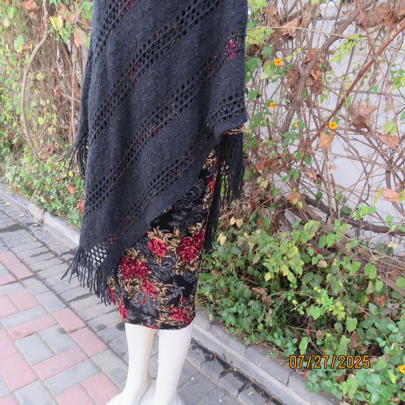 Black acrylic knit throw in pretty pattern. Fringed. Size 34-36.