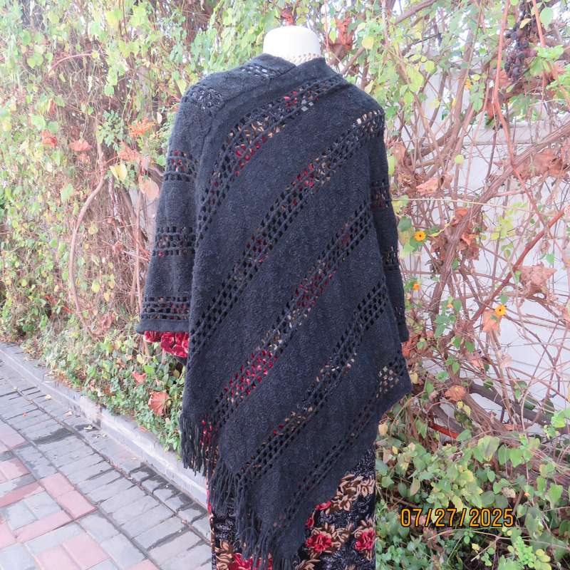 Black acrylic knit throw in pretty pattern. Fringed. Size 34-36.