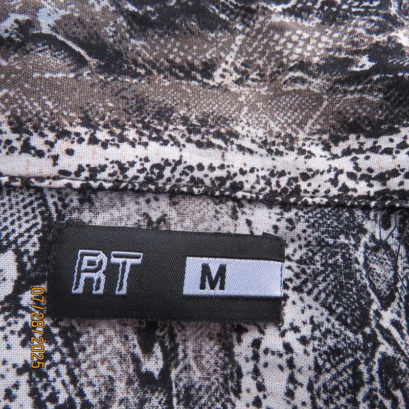 Snakeskin black-white long sleeve cropped viscose top. Open collar. Size 36