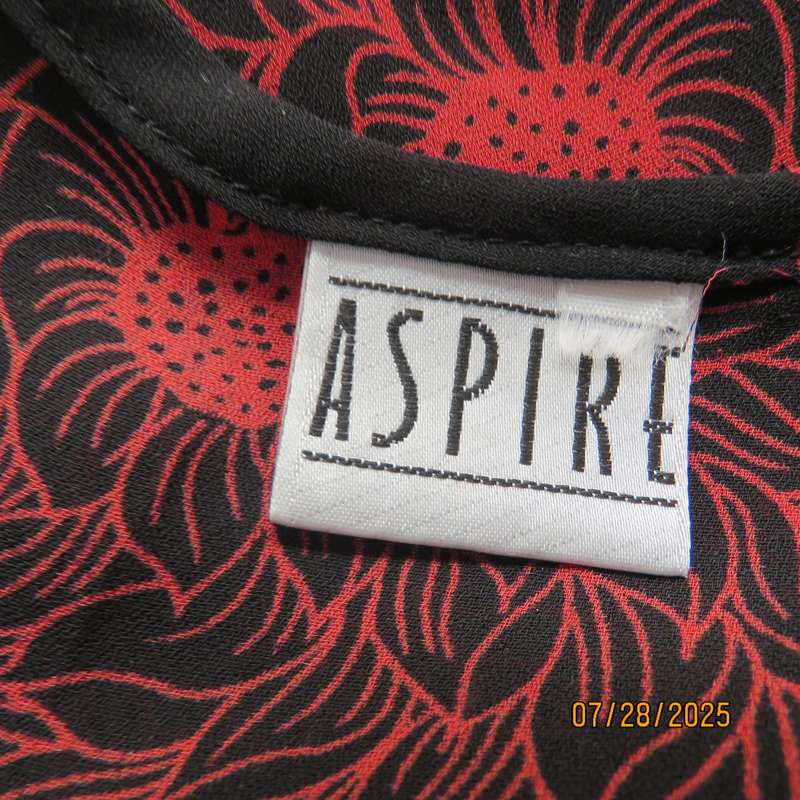 ASPIRE black polyester with red-white bold floral pattern. Unique sleeves. Size 36