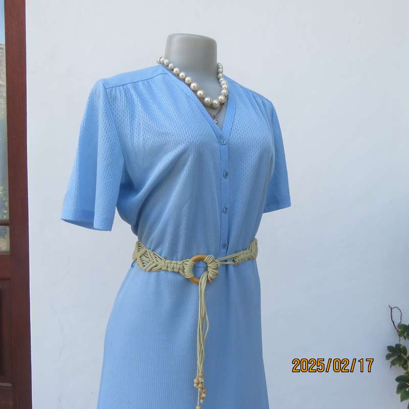 Vintage power blue poly-nylon short sleeve dress. Button down V neck top. A line bottom.Size 36.