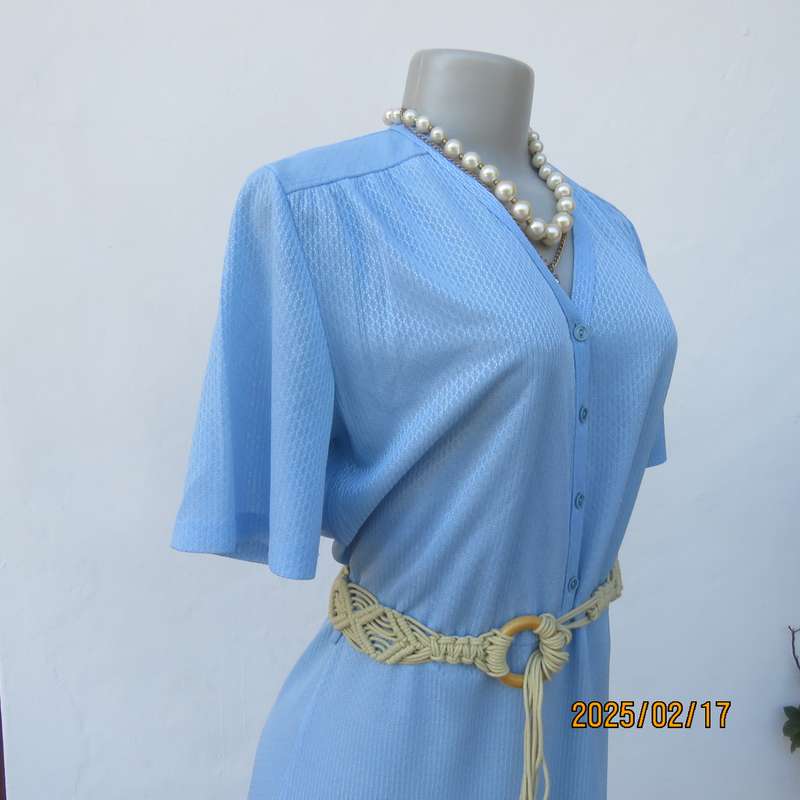 Vintage power blue poly-nylon short sleeve dress. Button down V neck top. A line bottom.Size 36.