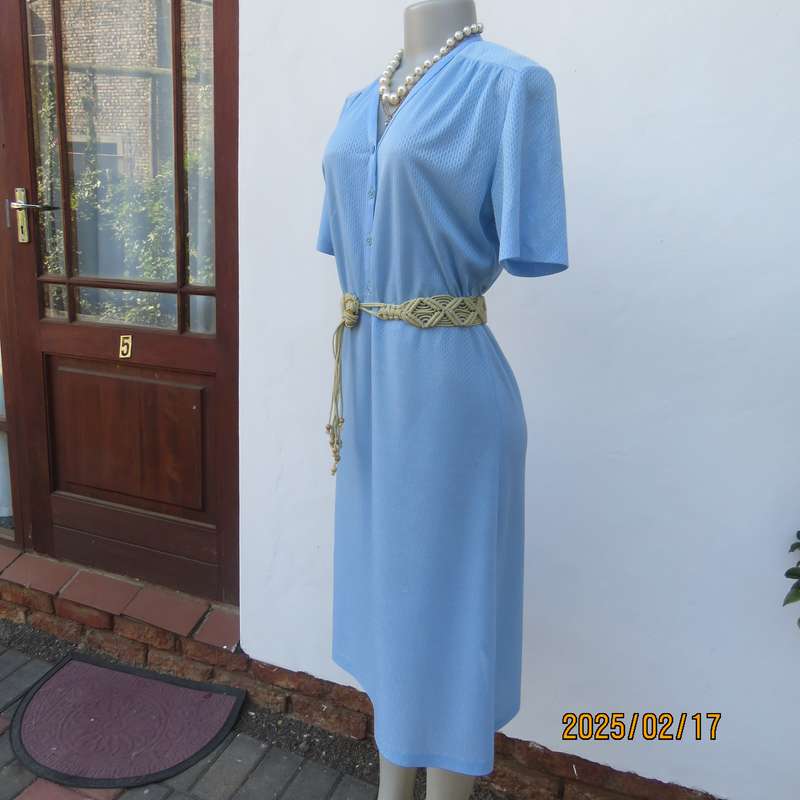 Vintage power blue poly-nylon short sleeve dress. Button down V neck top. A line bottom.Size 36.