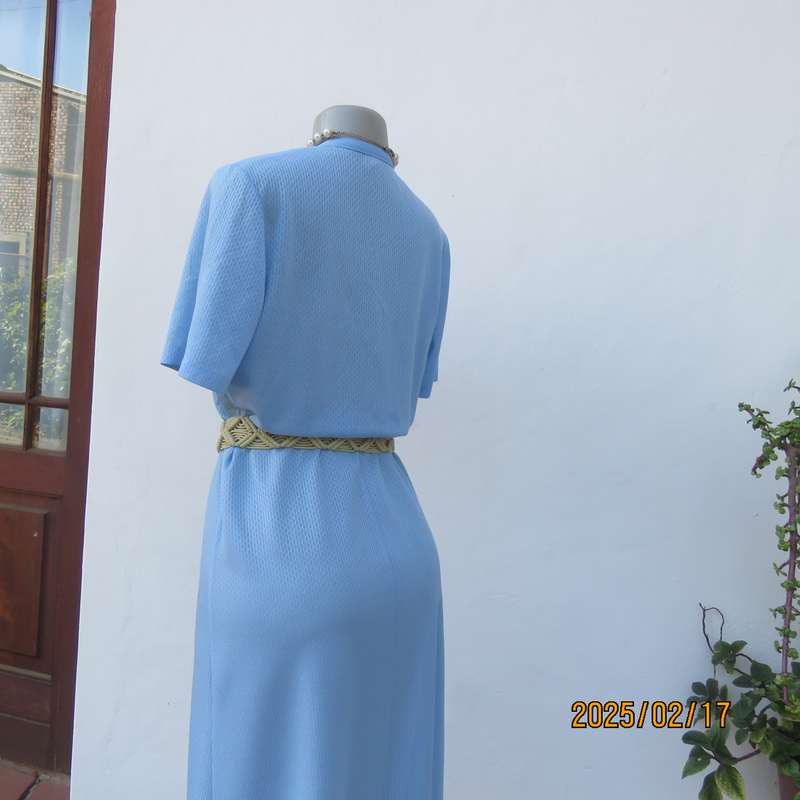 Vintage power blue poly-nylon short sleeve dress. Button down V neck top. A line bottom.Size 36.