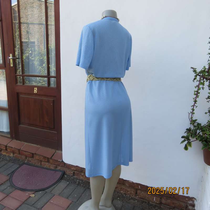 Vintage power blue poly-nylon short sleeve dress. Button down V neck top. A line bottom.Size 36.
