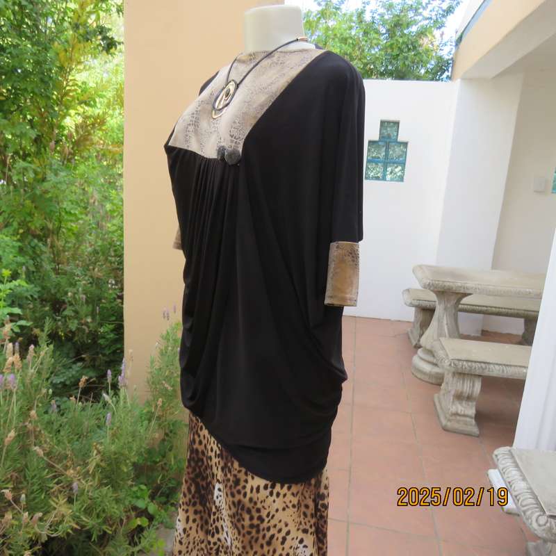 Elegant black stretch polyester long top. Animal print inlays. Size 32 to 34. Pretty off -line pleat