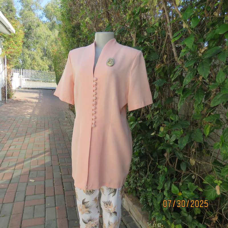 Light apricot colour boutique made long short sleeve tailored jacket. Size 42.