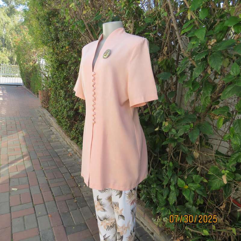 Light apricot colour boutique made long short sleeve tailored jacket. Size 42.