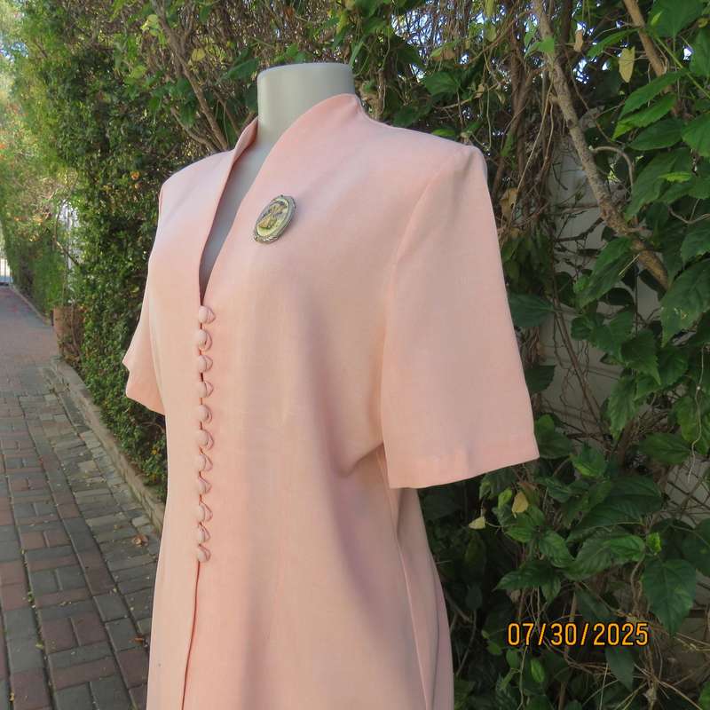 Light apricot colour boutique made long short sleeve tailored jacket. Size 42.