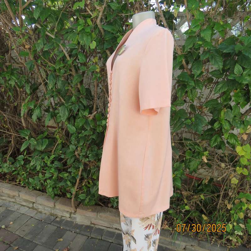 Light apricot colour boutique made long short sleeve tailored jacket. Size 42.