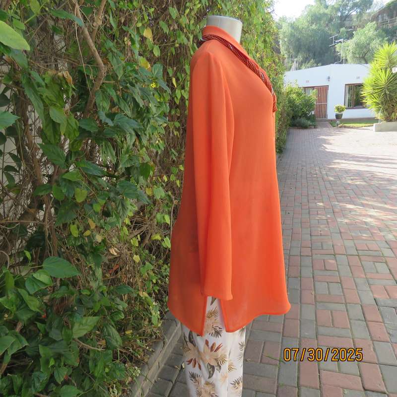 Tangerine crinkled polyester long sleeve button down size 42 top. Open collar