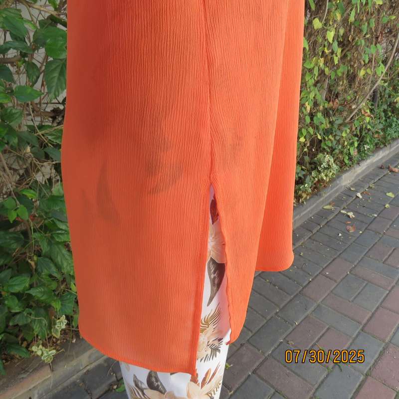 Tangerine crinkled polyester long sleeve button down size 42 top. Open collar