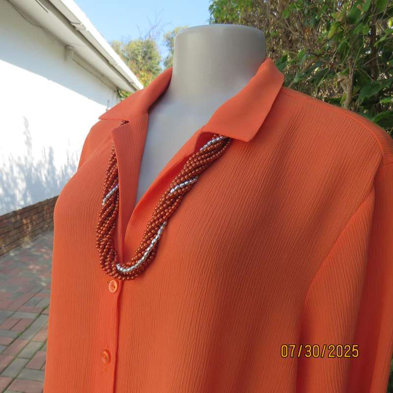 Tangerine crinkled polyester long sleeve button down size 42 top. Open collar