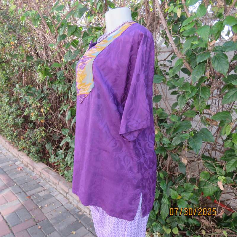 Purple print ethnic short sleeve slip over top with colourful bib. Size 38